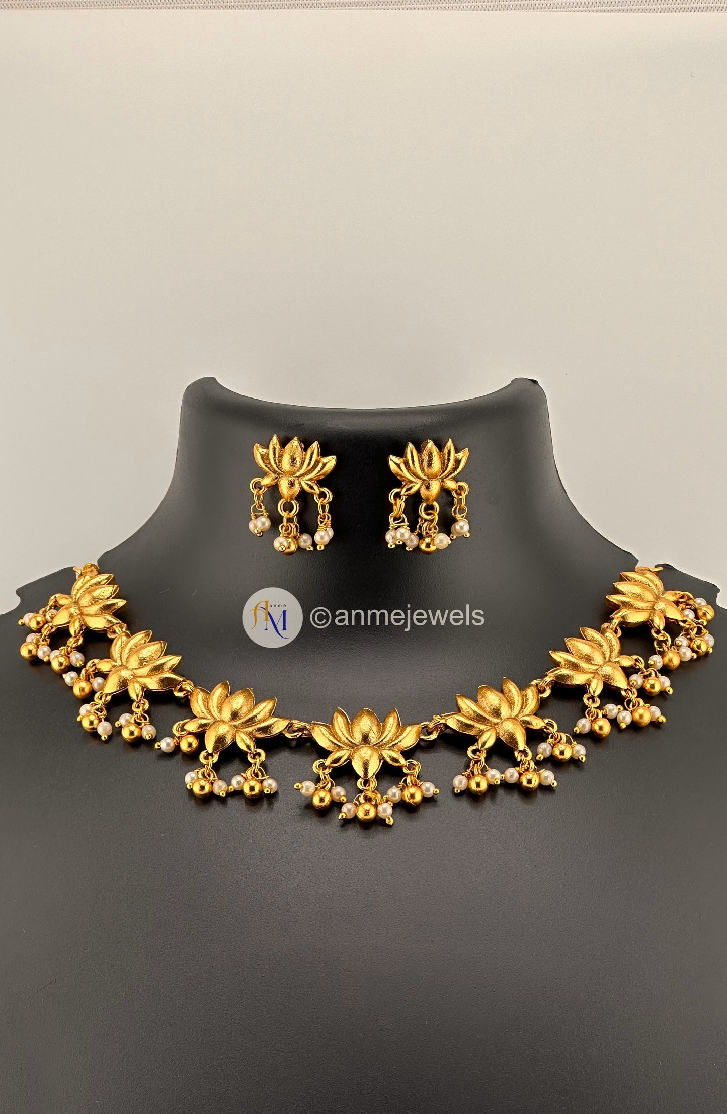 Trending Golden Lotus necklace set with beautiful pearl hangings and earrings