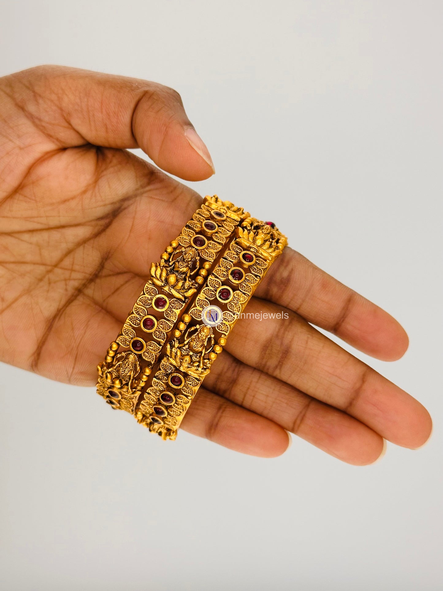 Elegant matte finish ruby floral and goddess lakshmi bangle set