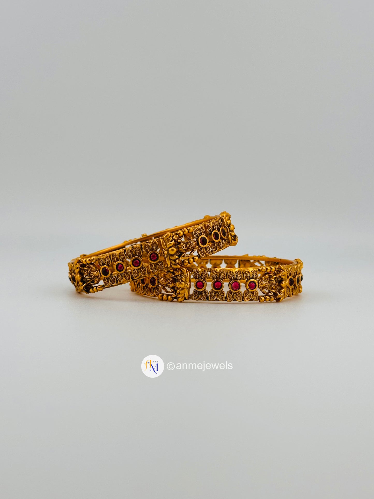 Elegant matte finish ruby floral and goddess lakshmi bangle set