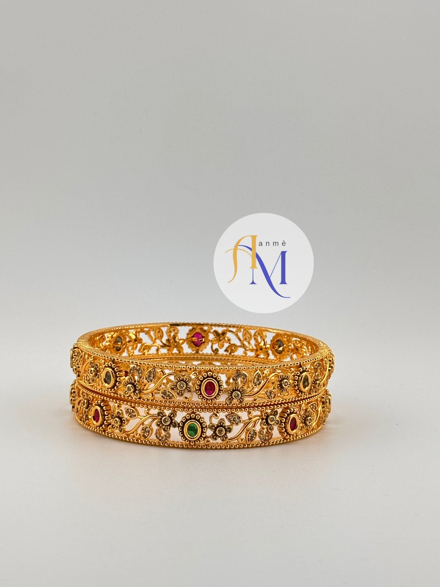 Beautiful Floral design in white stones with Ruby Green stone Bangles(Set of 2)
