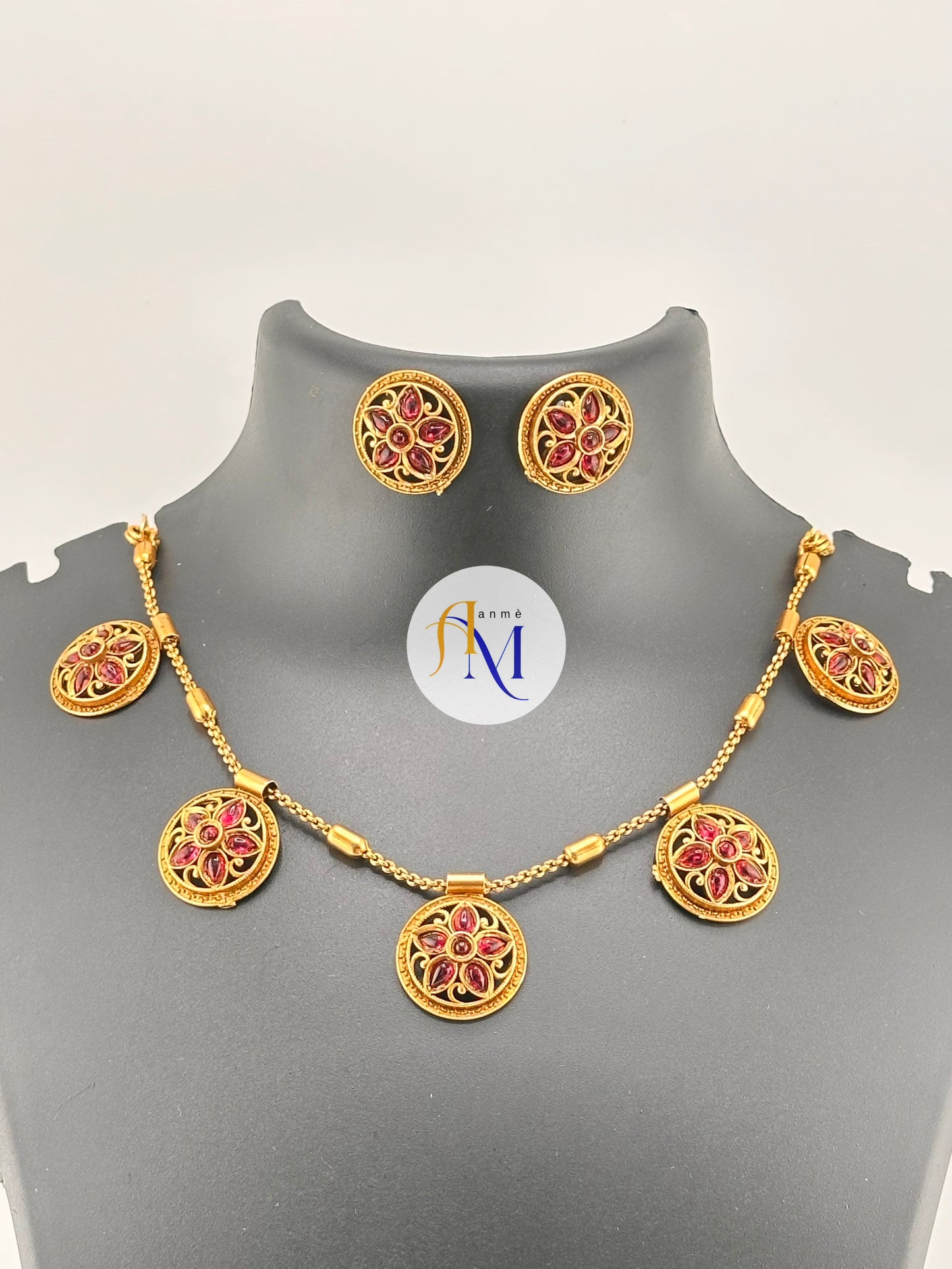 Antique gold toned medallions featuring white-green-ruby stones necklace/choker set