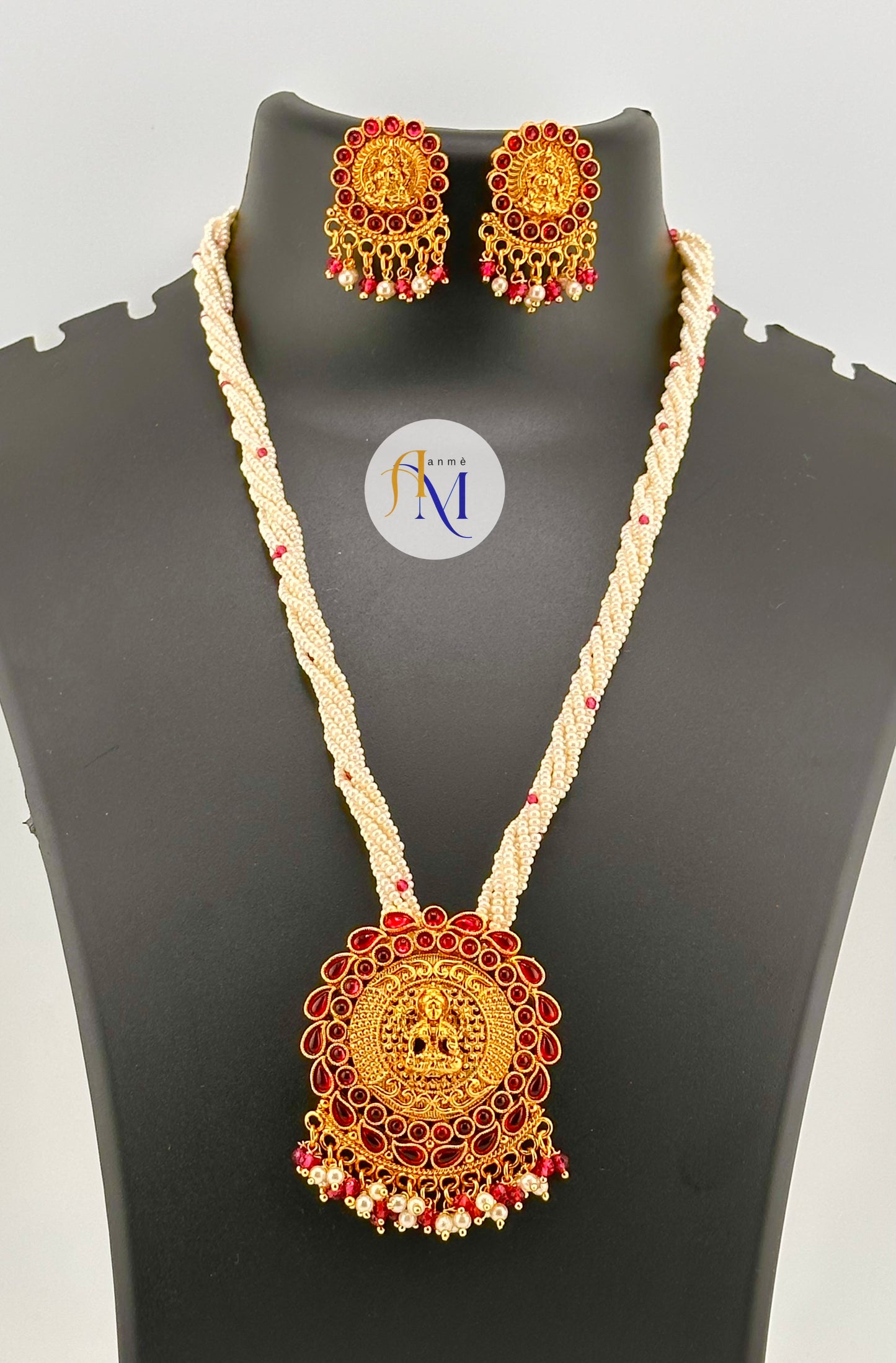 Pretty looking pearl chain long harams with golden lakshmi pendant with earrings(Available in 2 colors)