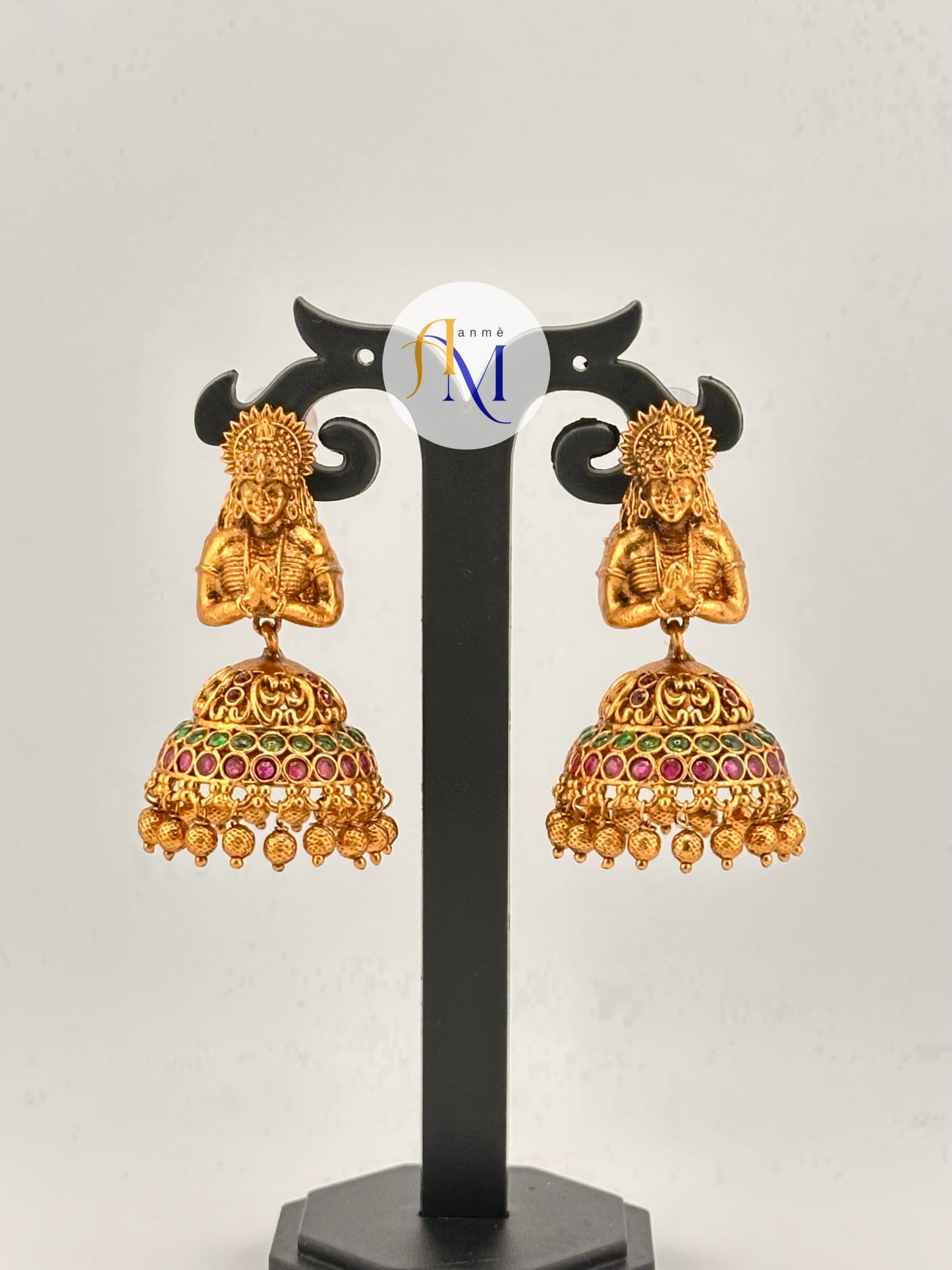Beautiful woman figurine with classic bell-shaped jhumka design, adorned with colorful stones
