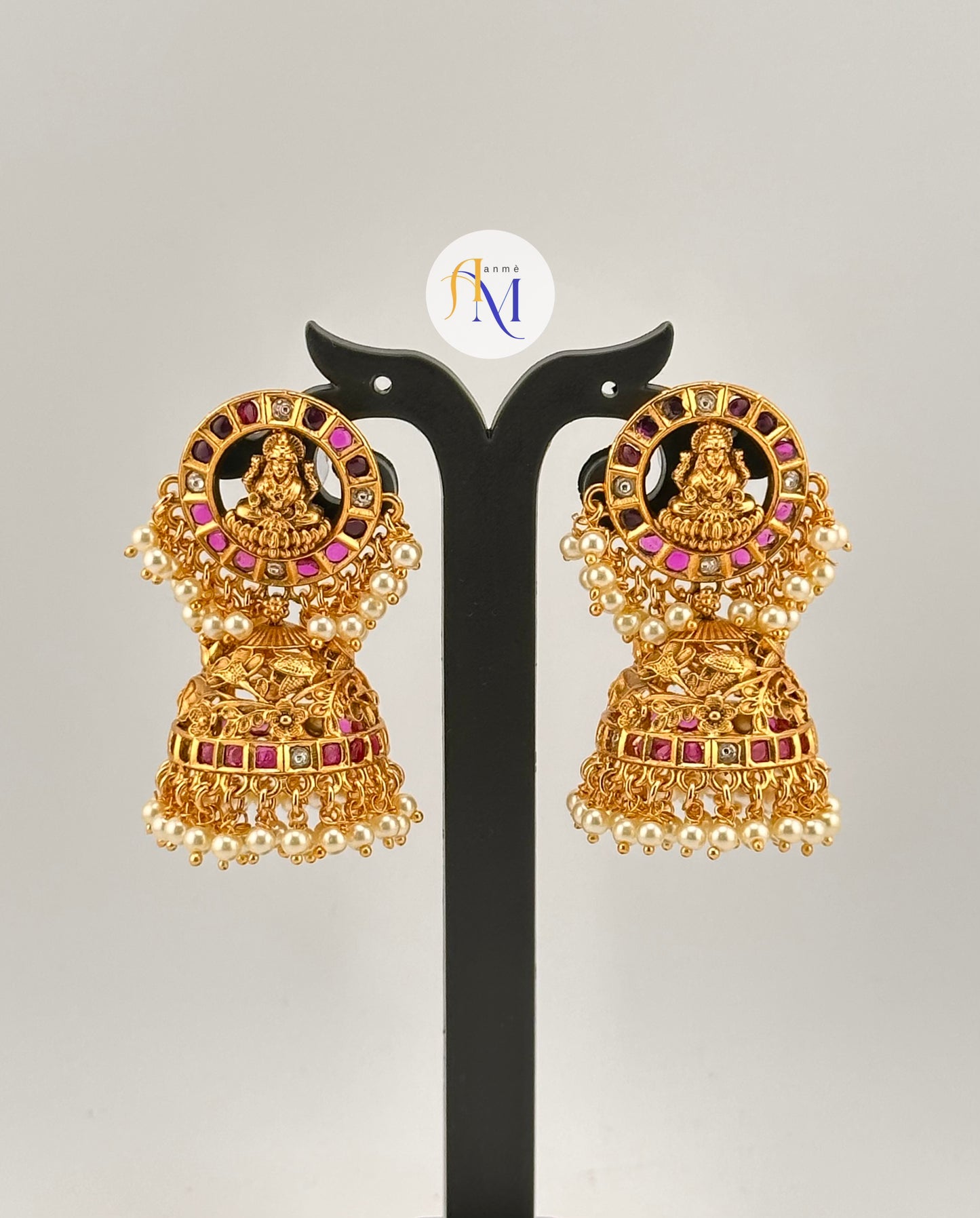 Beautiful Goddess Lakshmi and floral design earrings with ruby-green-white stones and white pearl hangings