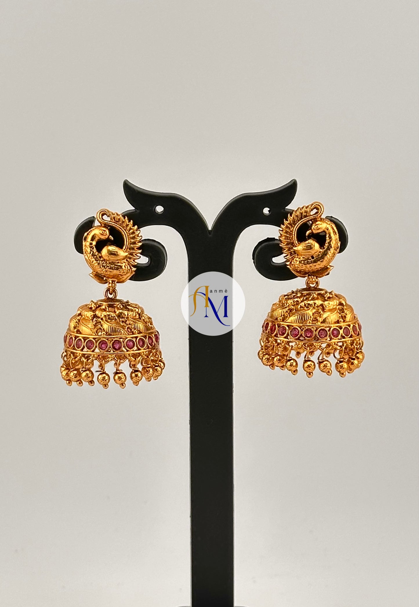 Beautiful peacock design earrings with ruby or green stones