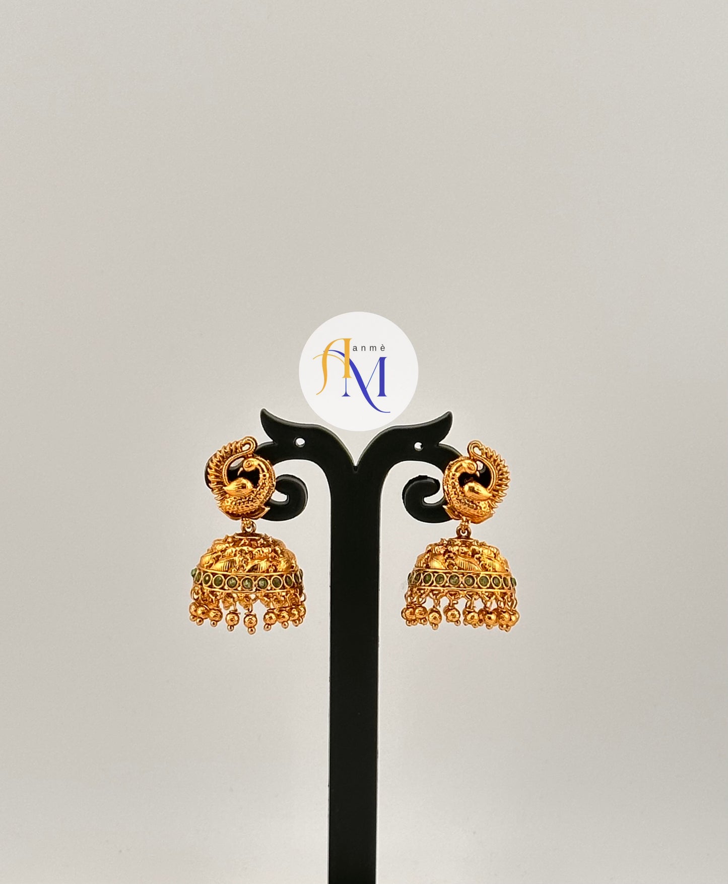 Beautiful peacock design earrings with ruby or green stones