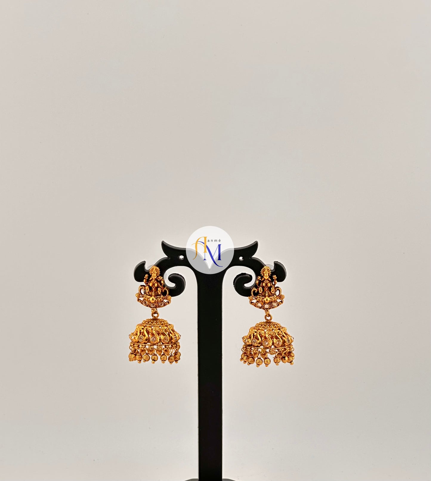 Simple temple design Jhumkas with lakshmi and swan motifs(Available in 4 colors)