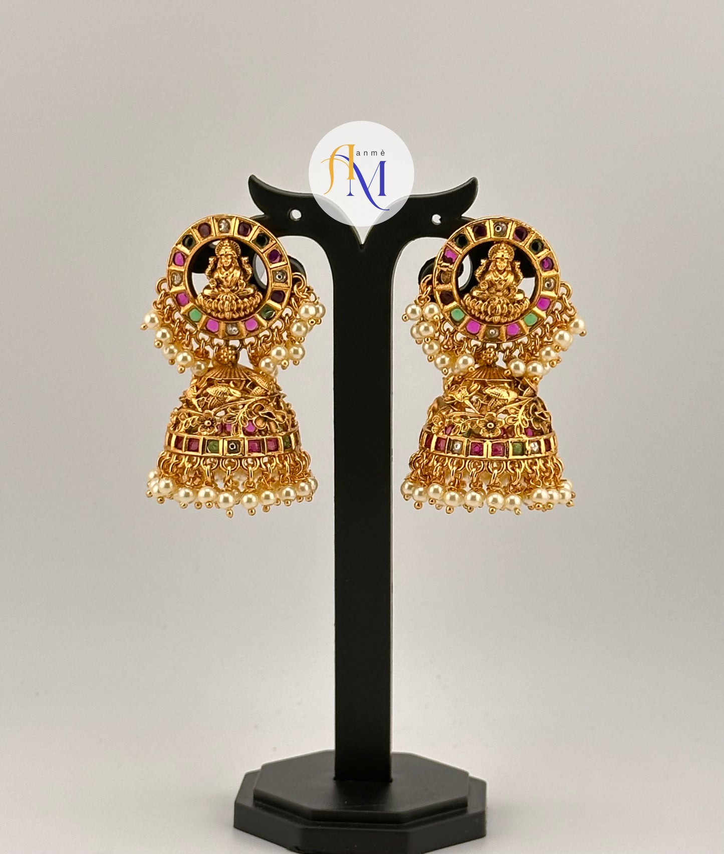 Beautiful Goddess Lakshmi and floral design earrings with ruby-green-white stones and white pearl hangings
