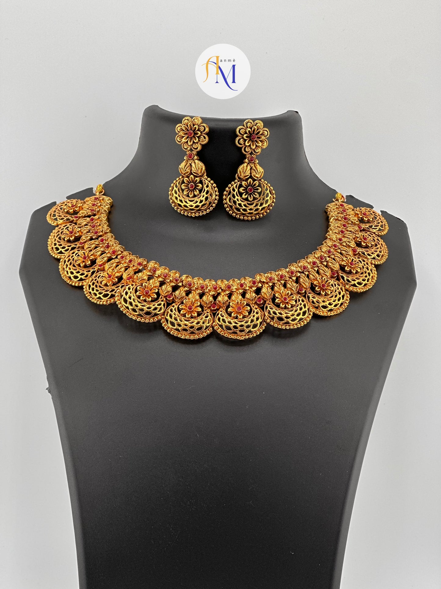 Beautiful floral design necklace with long earrings with ruby stones