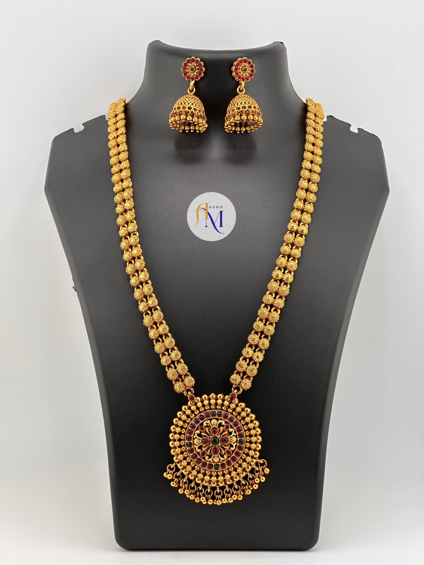 Antique round pendant with golden pearl hangings and beautiful jhumkas