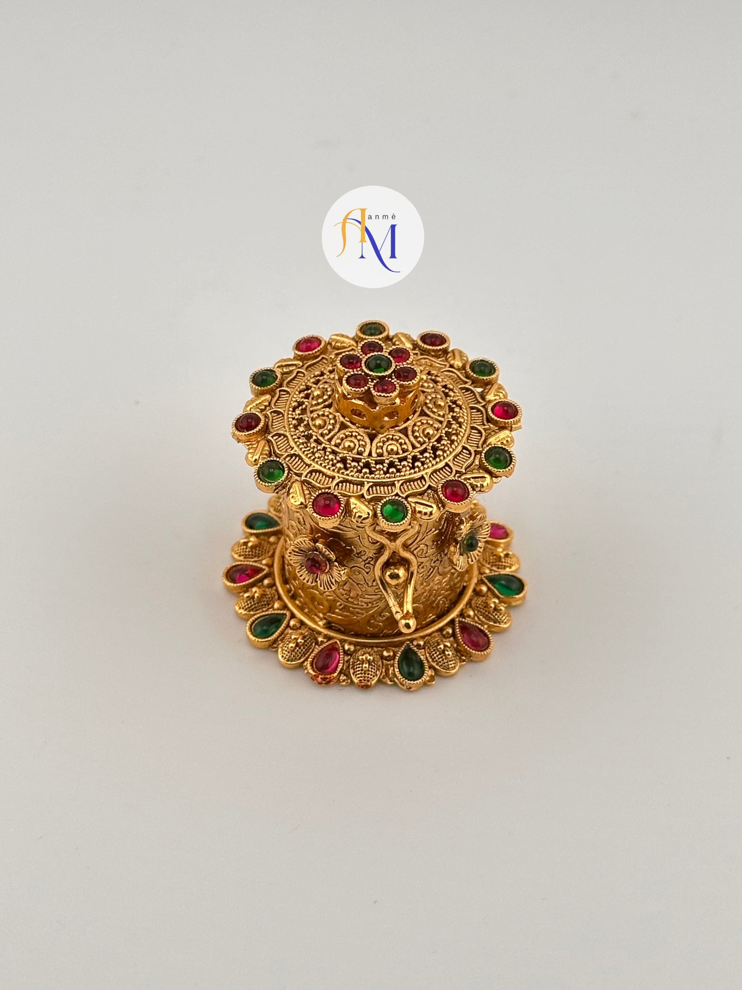 Beautiful Kumkum box with ruby and green stones with floral designs
