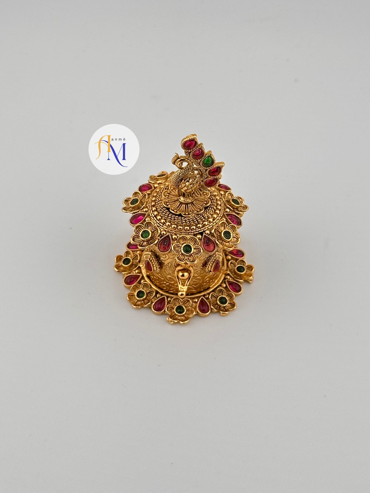 Beautiful peacock design kumkum box with ruby green stones
