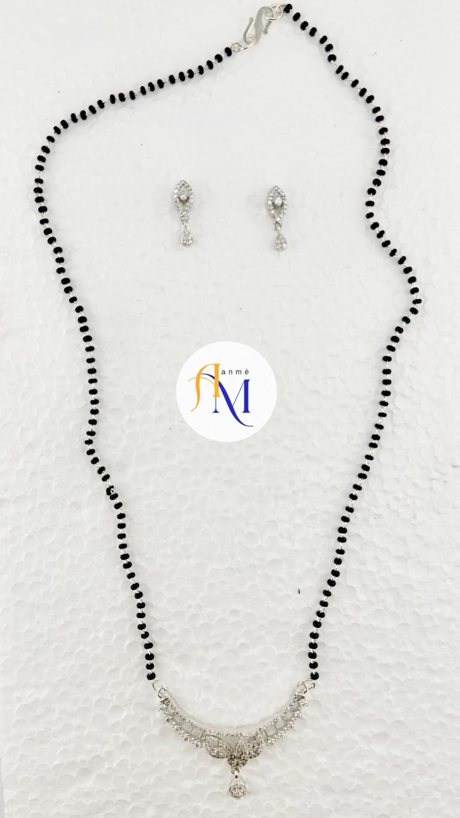 Simple classic beads mangalsutra with silver pendant with stone work and cute earrings