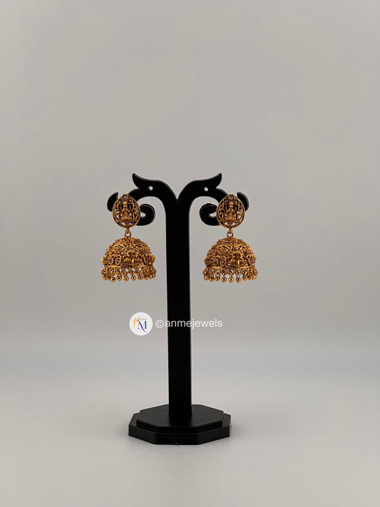 Temple style Lakshmi design golden with white stone jhumkas(gold hangings and white pearl hangings)