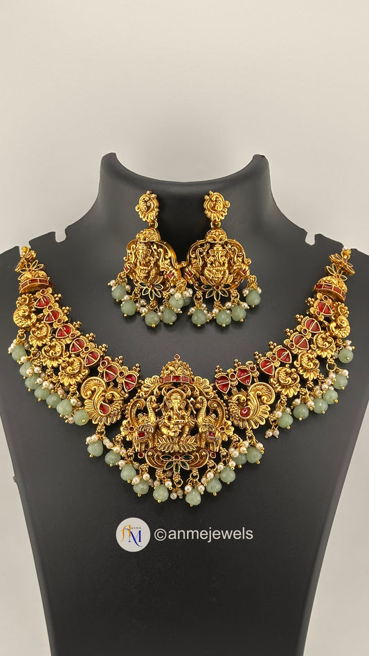 Elegant Ganesha pendant with peacock design and pastel hangings necklace set with earrings
