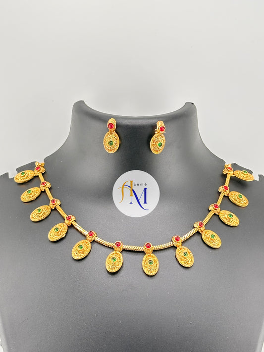 Antique oval coin necklace set with ruby-green stones