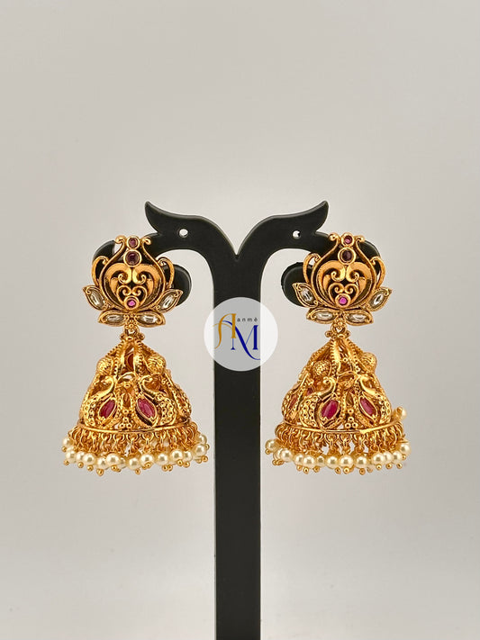 Beautiful peacock design jhumkas with ruby-white stones and white pearl hangings
