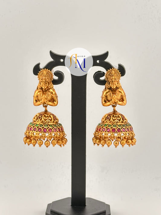 Beautiful woman figurine with classic bell-shaped jhumka design, adorned with colorful stones