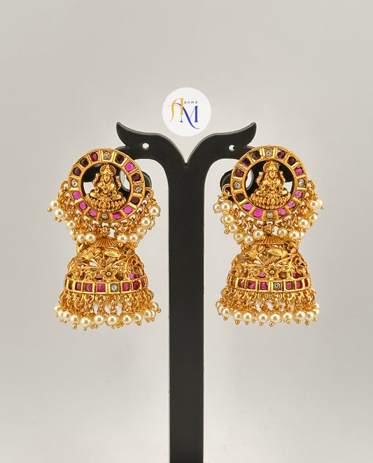 Beautiful Goddess Lakshmi and floral design earrings with ruby-green-white stones and white pearl hangings