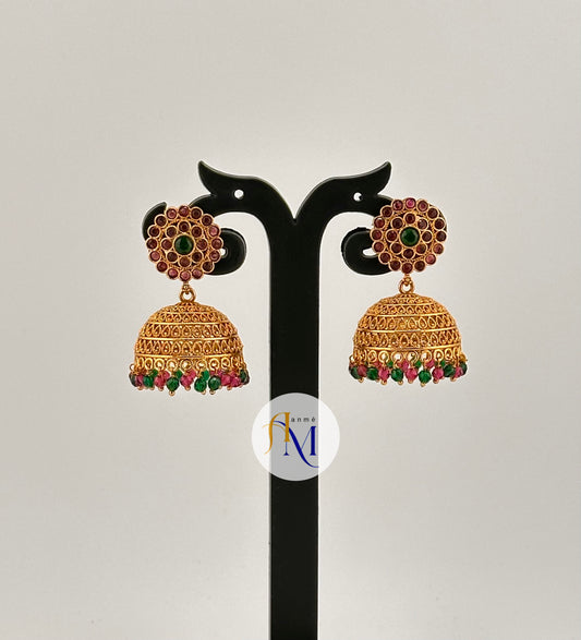 Simple floral work in ruby-green stones and ruby-green pearl hangings Jhumkas