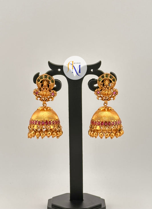 Beautiful dome shaped Jhumkas with ruby-green stone and lakshmi motifs