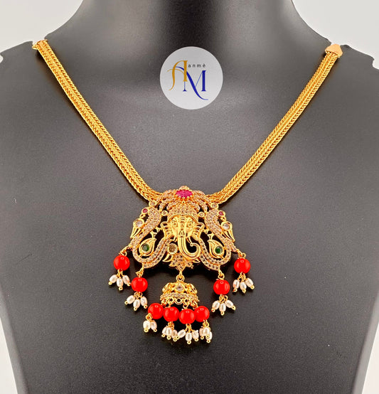 Unique and sparkling Ganesha pendant with white-green-ruby stones and beautiful pearl hangings necklace