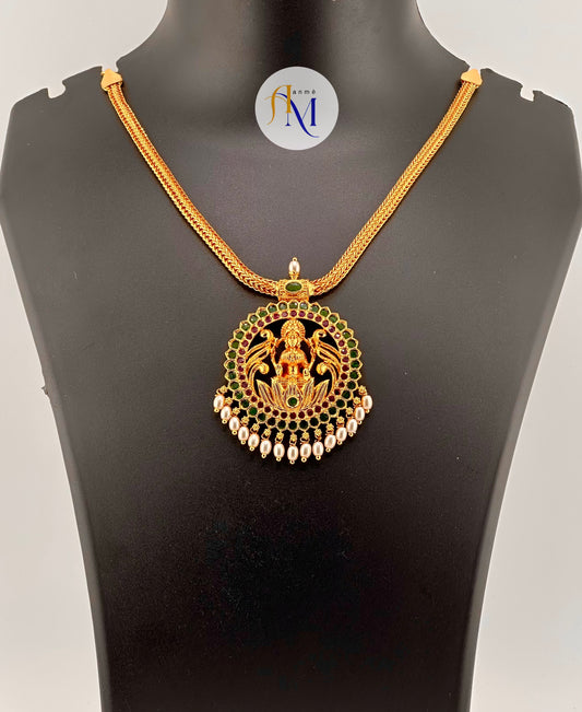 Beautiful round Lakshmi pendant with ruby-green stones and white pearl hangings necklace