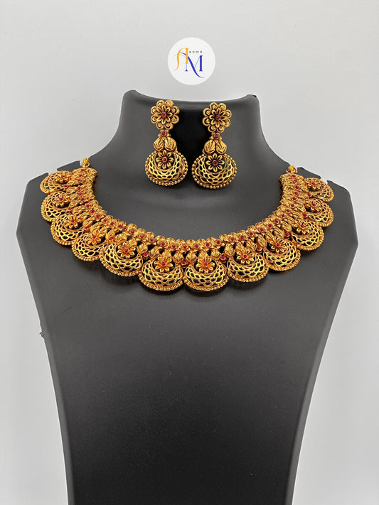 Beautiful floral design necklace with long earrings with ruby stones