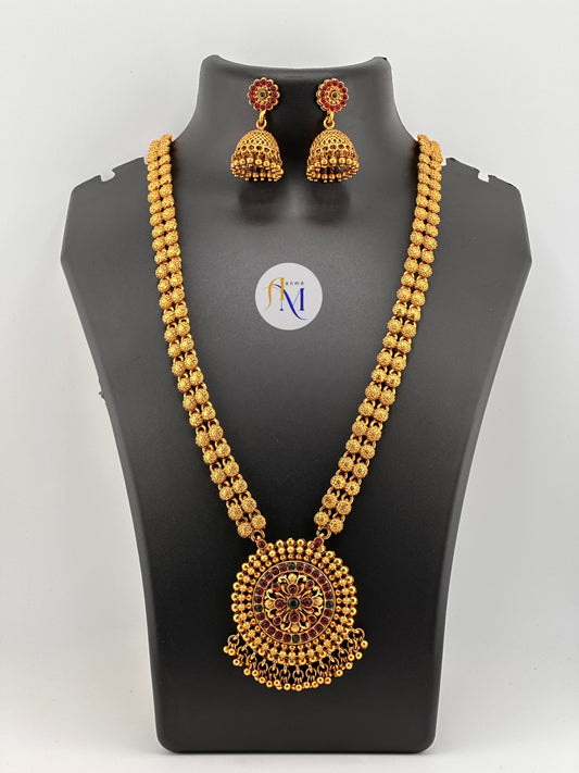 Antique round pendant with golden pearl hangings and beautiful jhumkas