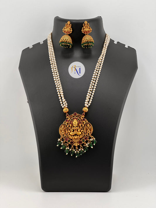 Beautiful lakshmi pendant with green-white pearl hangings and 3 layer pearl chain with earrings