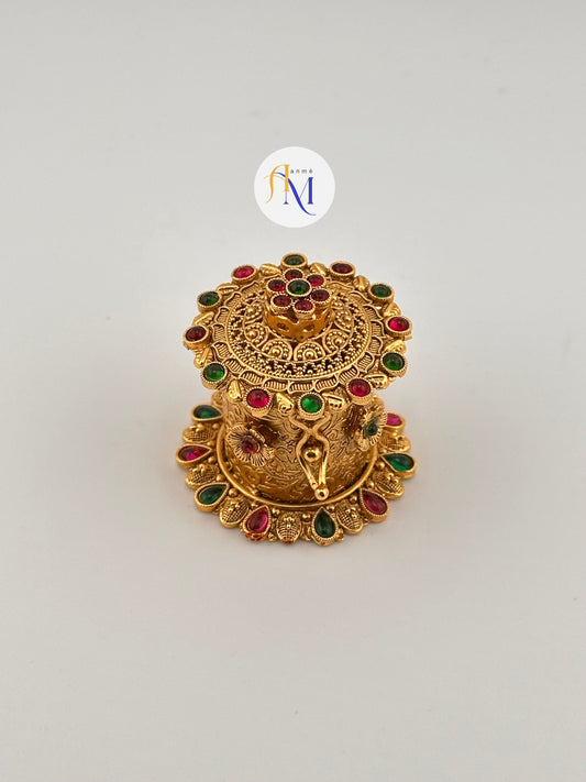 Beautiful Kumkum box with ruby and green stones with floral designs